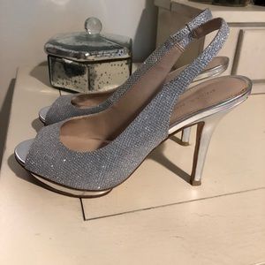 Pelle Moda silver platforms